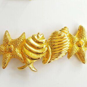 VINTAGE RUNWAY DOTTY SMITH SEASHELLS BELT BUCKLE GOLD COLOR STARFISH SHELLS